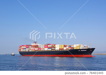 A large container ship entering the port of Osaka 76401445