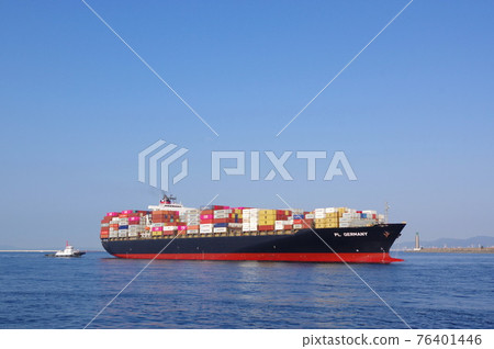 A large container ship entering the port of Osaka 76401446