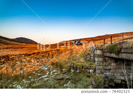 Winter sunset at the Glenveagh National Park in County Donegal - Ireland Winter sunset at the Glenveagh National Park in County Donegal - Ireland 76402325