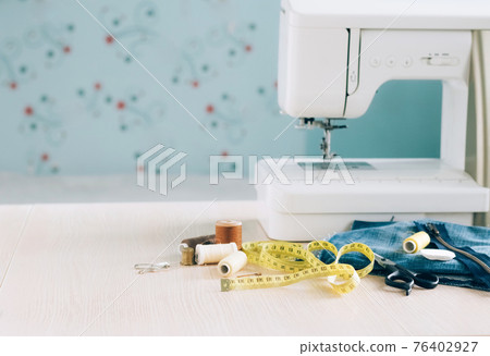 Sewing machine sewing accessories scissors thread buttons for repairing or sewing clothes on a desktop 76402927