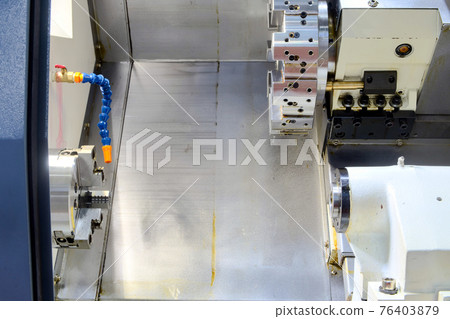 Inside CNC lathe machine, machine tools for turning and cutting workpiece on smart factory, industrial 4.0  76403879