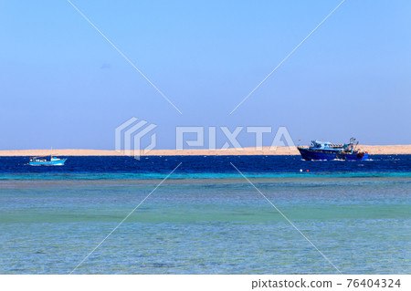 Fishing trawler and old fishing boat sails at Red sea in Hurghada, Egypt 76404324