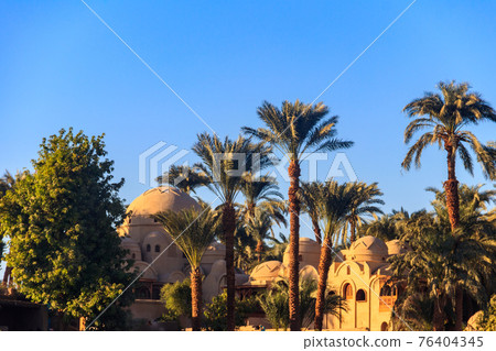 Buildings on a bank of the Nile river in Luxor, Egypt Buildings on a bank of the Nile river in Luxor, Egypt 76404345