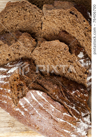 cut into pieces delicious fresh loaf of bread cut into pieces delicious fresh loaf of bread 76406700