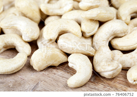 delicious and healthy raw cashew nuts, close up delicious and healthy raw cashew nuts, close up 76406752