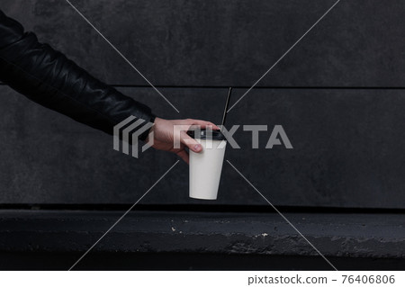 disposable paper cup of coffee 76406806