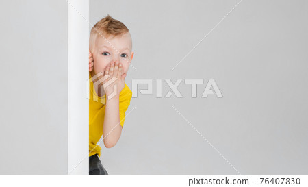 Happy boy isolated on white studio background. Looks happy, cheerful, sincere. Copyspace. Childhood, education, emotions concept Happy boy isolated on white studio background. Looks happy, cheerful, sincere. Copyspace. Childhood, education, emotions concept 76407830