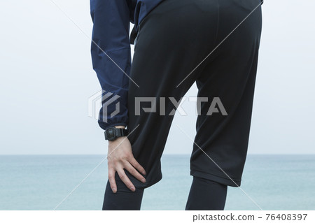 Male middle jogging at the beach Male middle jogging at the beach 76408397
