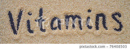 Quinoa on a black background and an inscription with a finger - vitamins BANNER, LONG FORMAT Quinoa on a black background and an inscription with a finger - vitamins BANNER, LONG FORMAT 76408503