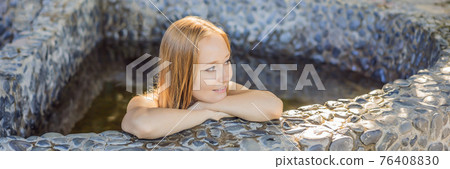BANNER, LONG FORMAT Woman relaxing in round outdoor fragrant herbal bath, organic skin care, luxury spa hotel, lifestyle photo BANNER, LONG FORMAT Woman relaxing in round outdoor fragrant herbal bath, organic skin care, luxury spa hotel, lifestyle photo 76408830