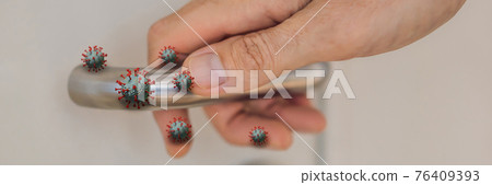 BANNER, LONG FORMAT Viruses on the doorknob. Coronovirus COVID 19. Human life through which germs and viruses spread, door handle. the concept of germs sitting on the door handle BANNER, LONG FORMAT Viruses on the doorknob. Coronovirus COVID 19. Human life through which germs and viruses spread, door handle. the concept of germs sitting on the door handle 76409393