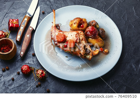 Roasted rabbit on a plate Roasted rabbit on a plate 76409510