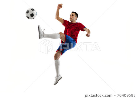Young Caucasian soccer football player training isolated on white background. 76409595