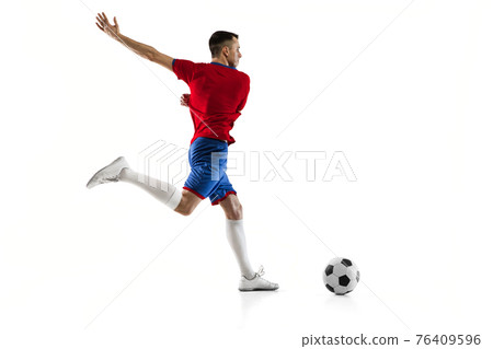 Young Caucasian soccer football player training isolated on white background. 76409596