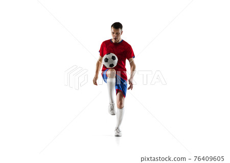 Porttrait of young soccer football player training isolated on white background. Porttrait of young soccer football player training isolated on white background. 76409605