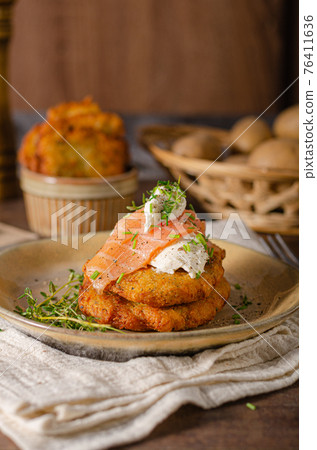 Delicious latkes with salmon 76411636