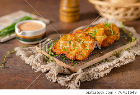 Homemade latkes with herbs Homemade latkes with herbs 76411649