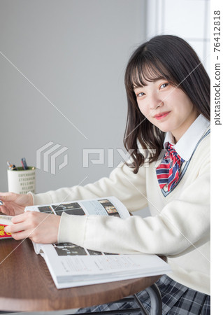 School girl who is studying 76412818