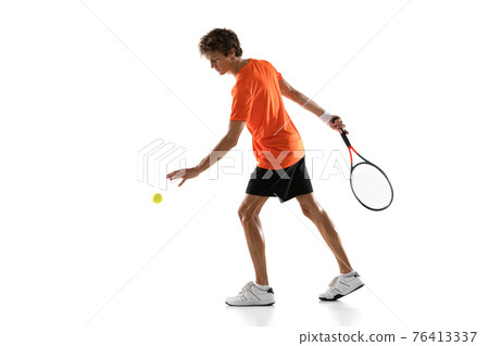 Young Caucasian man, tennis player posing isolated on white background. 76413337