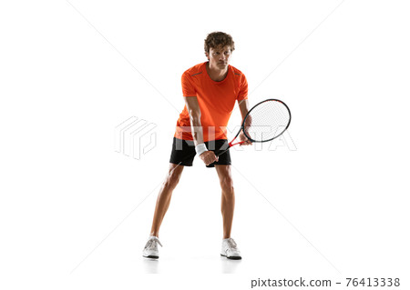 Young Caucasian man, tennis player posing isolated on white background. Young Caucasian man, tennis player posing isolated on white background. 76413338