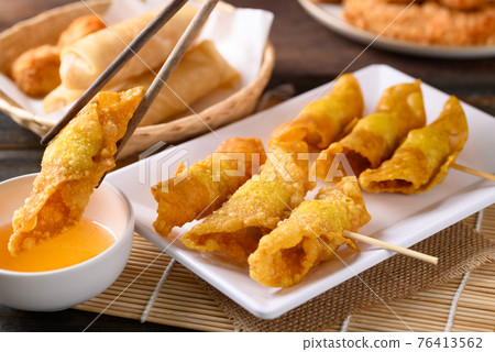 Asian deep fried crispy wonton stuffed with minced pork, quail egg and shrimp 76413562