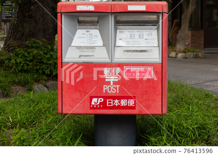 A mailbox installed on the sidewalk that can accommodate large mail A mailbox installed on the sidewalk that can accommodate large mail 76413596