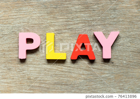 Color alphabet letter in word play on wood background Color alphabet letter in word play on wood background 76413896