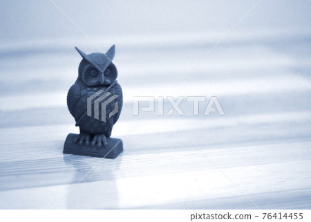 Model printed on 3d printer close-up. Owl of blue color. 76414455