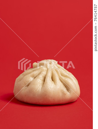 Bao dumpling minimalist isolated on a red background. 76414787