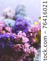 A bouquet of limonium in sun glare. Photo. card 76416021