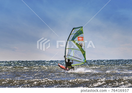 [Windsurfing in the spring storm with white waves] Sky synthesis] 76416937