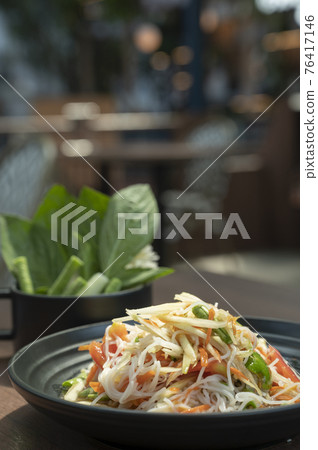 Food and beverages Fresh papaya salad Isan papaya salad in Thai restaurants Food and beverages Fresh papaya salad Isan papaya salad in Thai restaurants 76417146