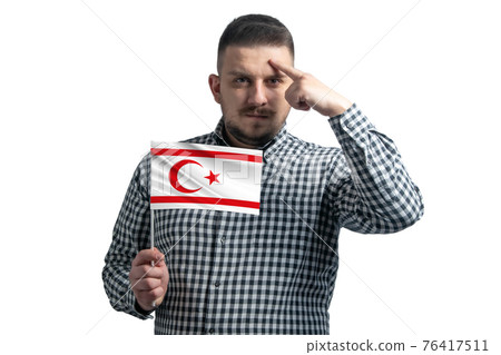 White guy holding a flag of Turkish Republic of Northern Cyprus and a finger touches the temple on the head isolated on a white background White guy holding a flag of Turkish Republic of Northern Cyprus and a finger touches the temple on the head isolated on a white background 76417511