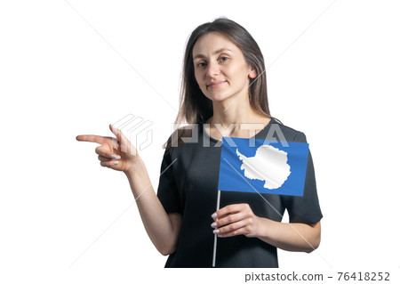 Happy young white woman holding flag Antarctica and points to the left isolated on a white background Happy young white woman holding flag Antarctica and points to the left isolated on a white background 76418252