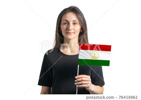 Happy young white girl holding Tajikistan flag isolated on a white background 76418962