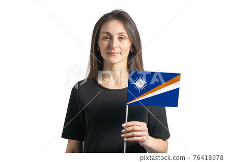 Happy young white girl holding Marshall Islands flag isolated on a white background 76418978