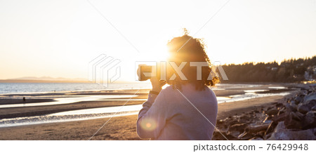 Adventure Travel Photographer at West Pacific Ocean Coast. Adventure Travel Photographer at West Pacific Ocean Coast. 76429948