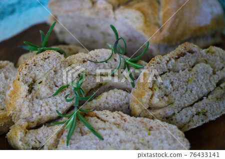 Freshly baked homemade bread in the oven. Freshly baked homemade bread in the oven. 76433141