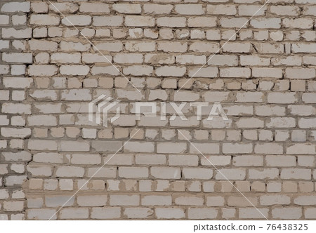 Brick wall. A wall that was being completed and attached to another wall. 76438325