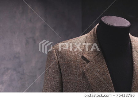 Suit jacket on male tailor mannequin  creative concept 76438786