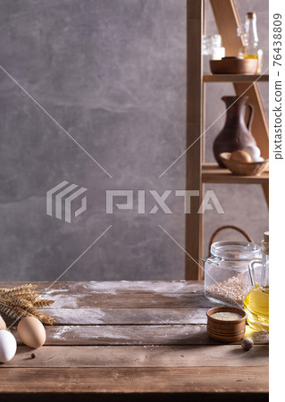 Bakery ingredients for homemade bread cooking or baking on table. Bread set at wooden tabletop Bakery ingredients for homemade bread cooking or baking on table. Bread set at wooden tabletop 76438809