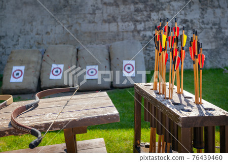 Arrows and bow, place for shooting from bow entertainment Arrows and bow, place for shooting from bow entertainment 76439460