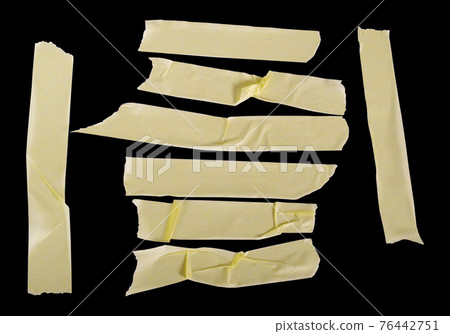 Various sizes of glued paper tape, masking tape, isolated on black background 76442751