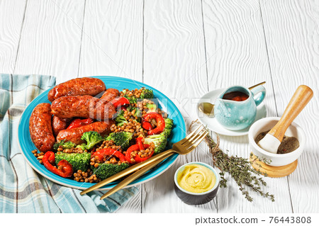 Italian sausages with lentils on a plate, top view Italian sausages with lentils on a plate, top view 76443808