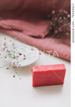 Natural handmade soap bar with ceramic soap dish and flowers, spa organic soap, sustainable lifestyle Natural handmade soap bar with ceramic soap dish and flowers, spa organic soap, sustainable lifestyle 76444827