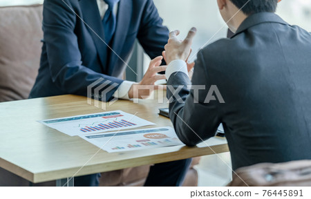 Businessman talking in the office 76445891