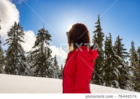 Adventure Woman Hiking on top of Canadian Mountains Adventure Woman Hiking on top of Canadian Mountains 76448574