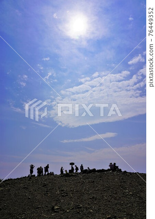 Climbers and the sun gathering at the summit of Mt. Irikasa Climbers and the sun gathering at the summit of Mt. Irikasa 76449352