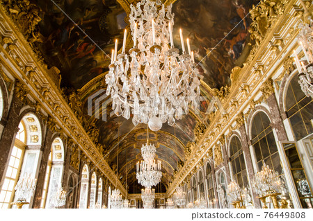 A stunning chandelier in the hall of mirrors of the Palace of Versailles in Paris, France 76449808