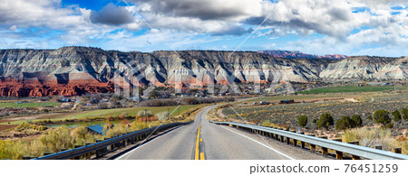 Panoramic View of a scenic route surrounded by mountains in the desert 76451259